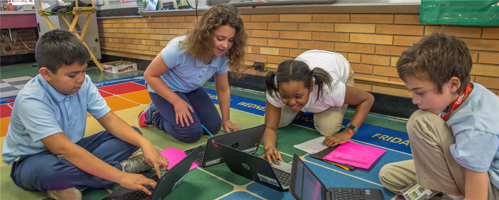 Learning Communities Elementary School - CMS students happy studying together